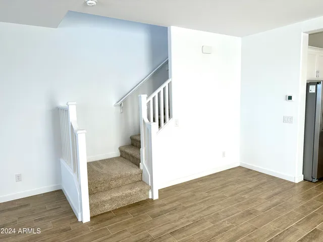 a view of an entryway with wooden floor