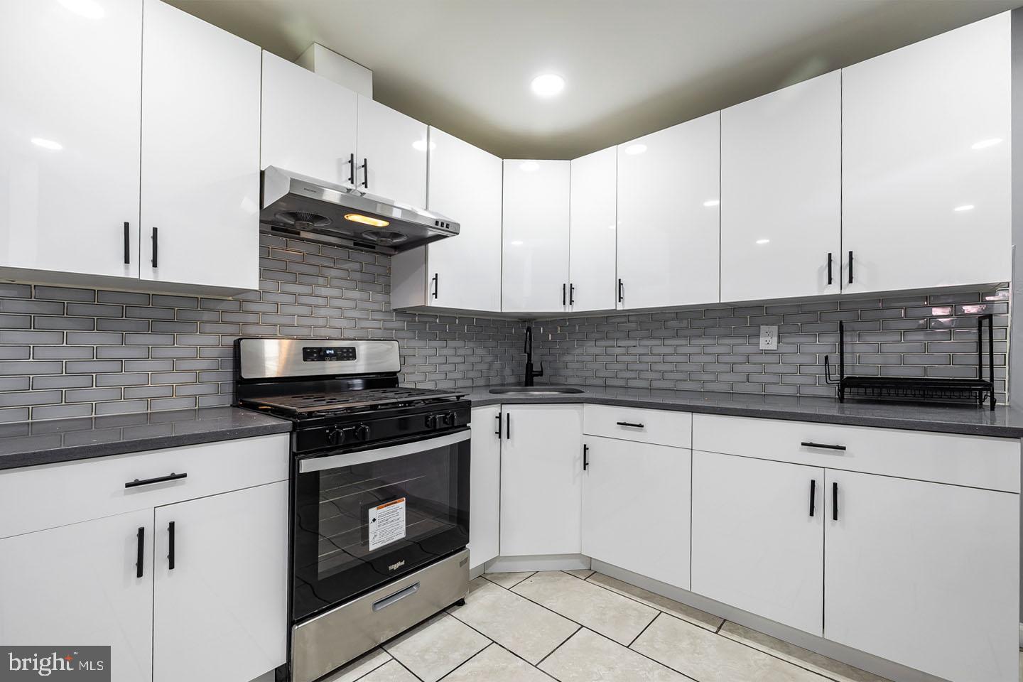 2 Cardinal Road Millville, NJ 08332 - Photo 13 of 39 a kitchen with stainless steel appliances granite countertop a sink a stove and cabinets