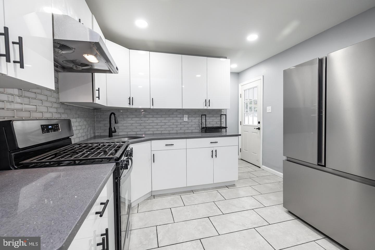 2 Cardinal Road Millville, NJ 08332 - Photo 14 of 39 a kitchen with stainless steel appliances granite countertop a stove a refrigerator and a sink