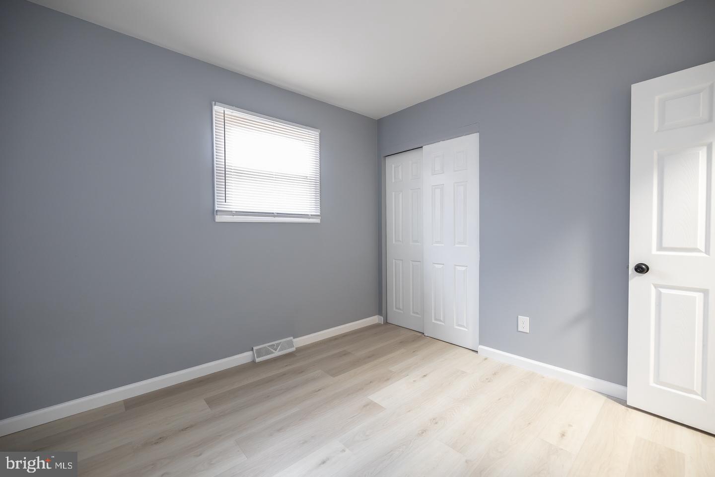 2 Cardinal Road Millville, NJ 08332 - Photo 16 of 39 an empty room with wooden floor and windows