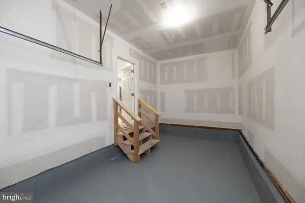 a view of an empty room with white walls