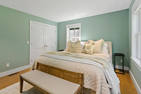 a bedroom with a bed and a table in it