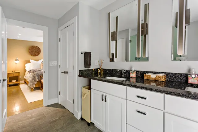a bathroom with a sink and a mirror