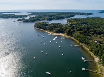 an aerial view of a house with a lake view