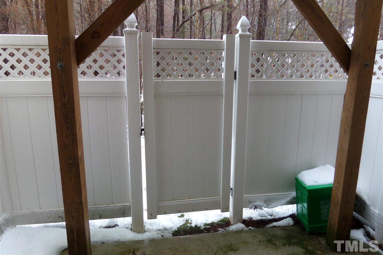 7872 Spungold Street Raleigh, NC 27617 - Photo 13 of 16 Fenced in patio from the basement