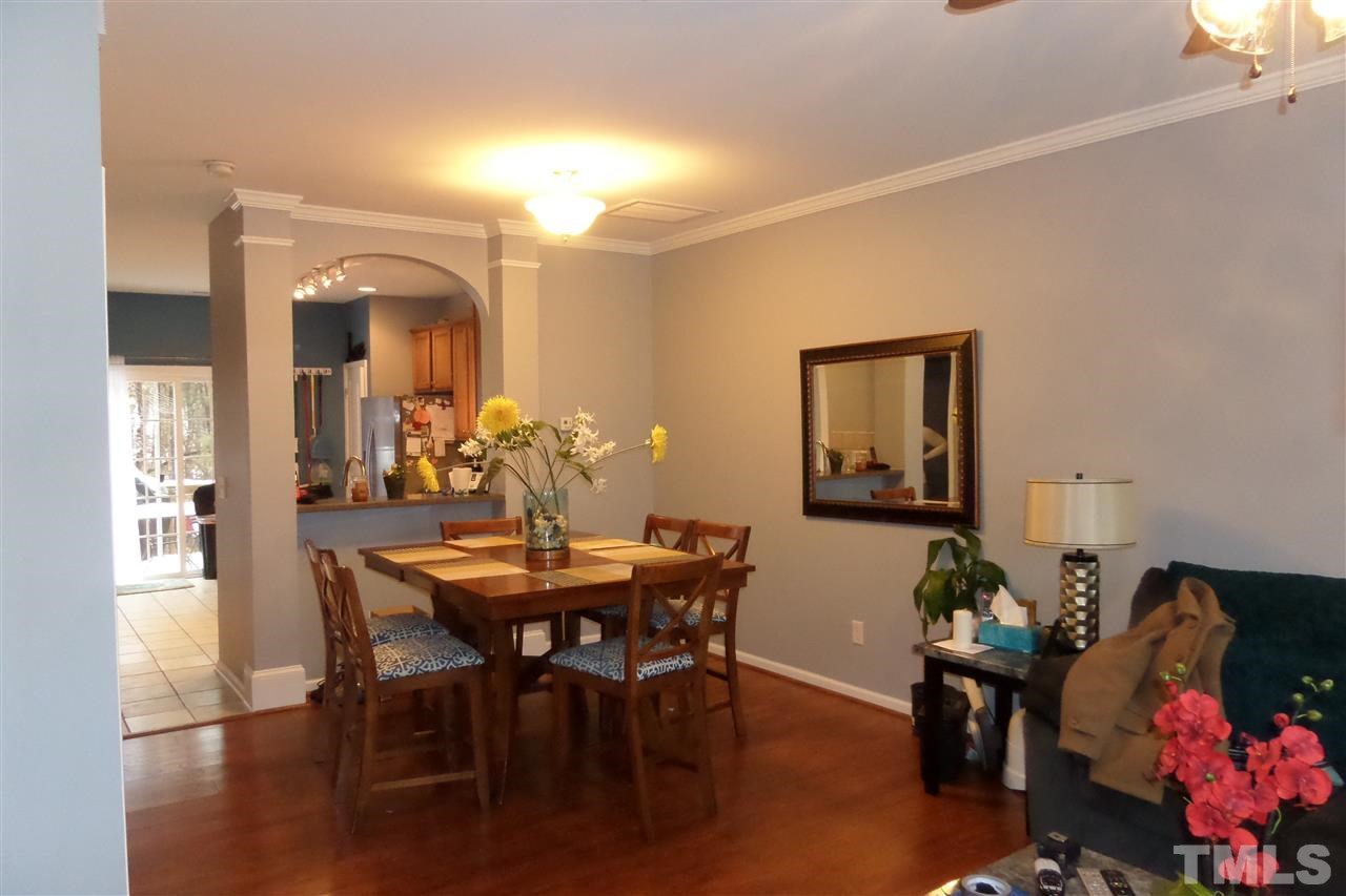 7872 Spungold Street Raleigh, NC 27617 - Photo 3 of 16 Separate Dining Room w/arch window to the kitchen