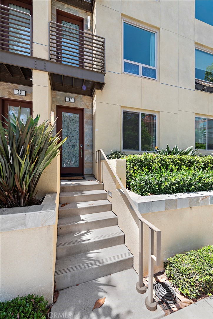 37 Soho Irvine, CA 92612 - Photo 1 of 21 a front view of a house with a porch