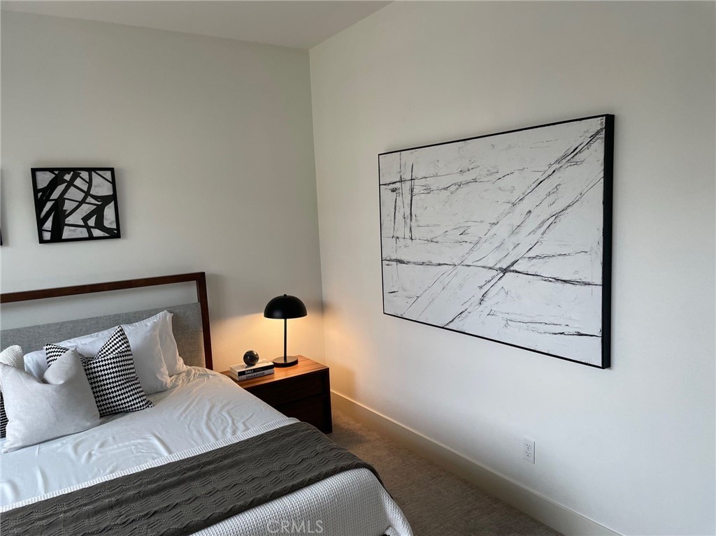37 Soho Irvine, CA 92612 - Photo 11 of 21 a bedroom with a bed and a painting on the wall