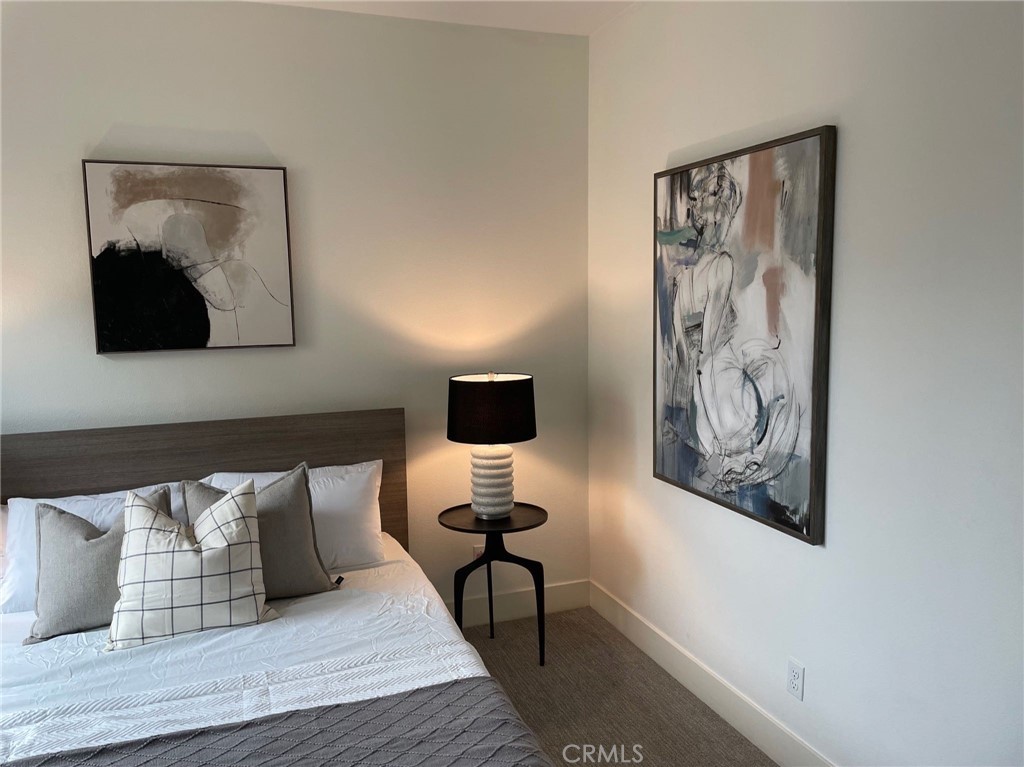 37 Soho Irvine, CA 92612 - Photo 18 of 21 a bedroom with a bed and painting on the wall