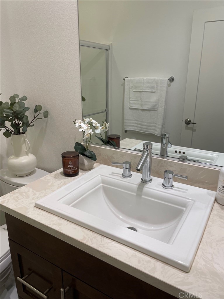 37 Soho Irvine, CA 92612 - Photo 20 of 21 a bathroom with a sink and a mirror
