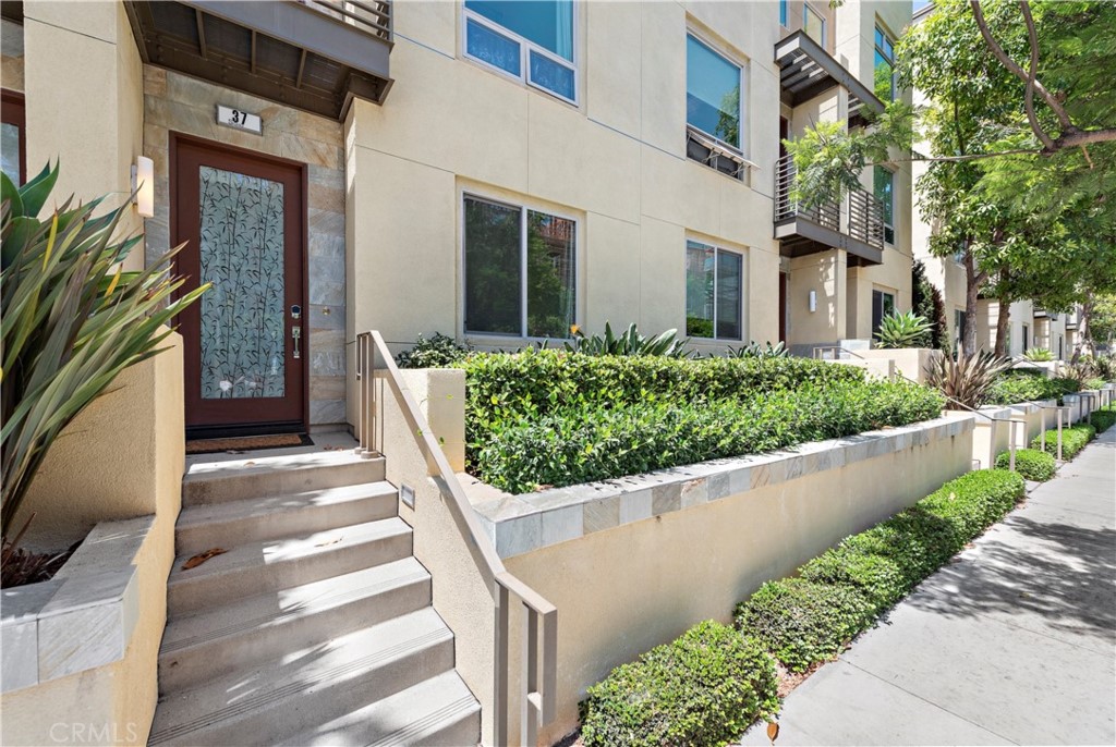 37 Soho Irvine, CA 92612 - Photo 2 of 21 a view of a house with a yard and pathway