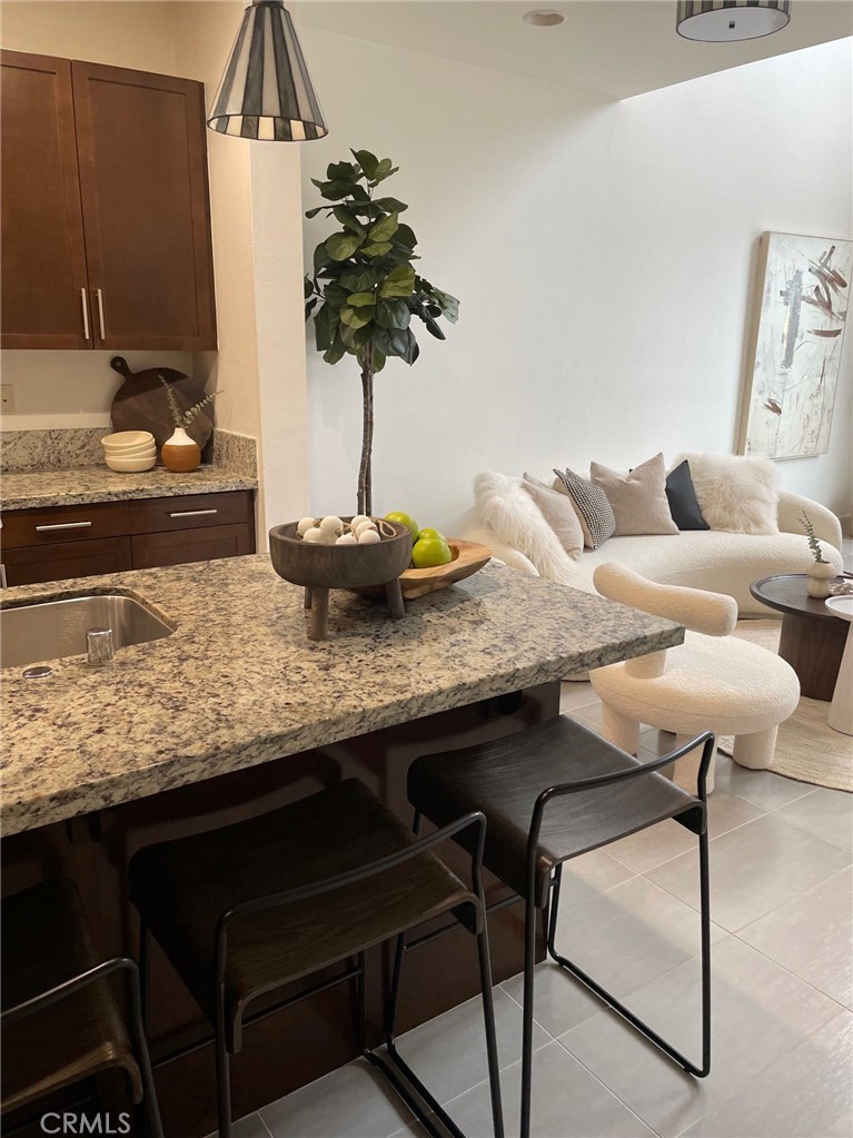 37 Soho Irvine, CA 92612 - Photo 7 of 21 a kitchen with a table and chairs in it