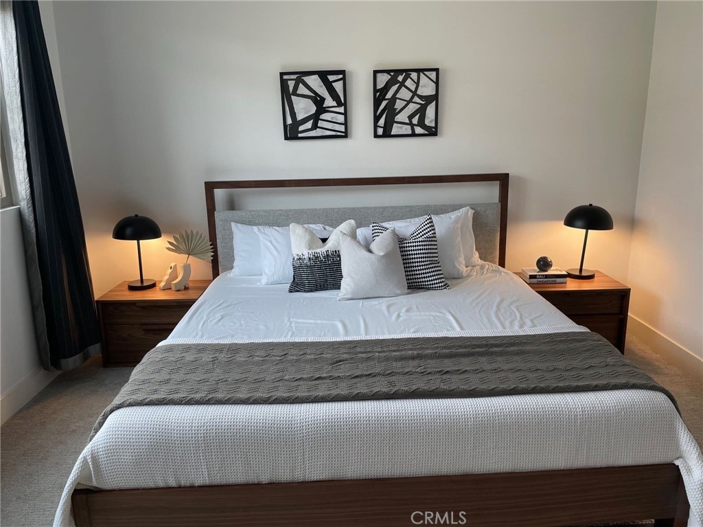 37 Soho Irvine, CA 92612 - Photo 10 of 21 a bedroom with a bed and painting on the wall