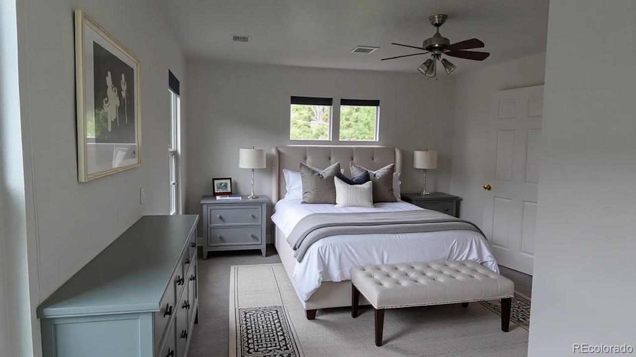 1480 Thunder Butte Road Castle Rock, CO 80109 - Photo 11 of 35 a bedroom with a bed a couch and a window