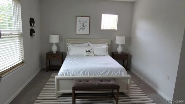 a bed room with a bed and a window