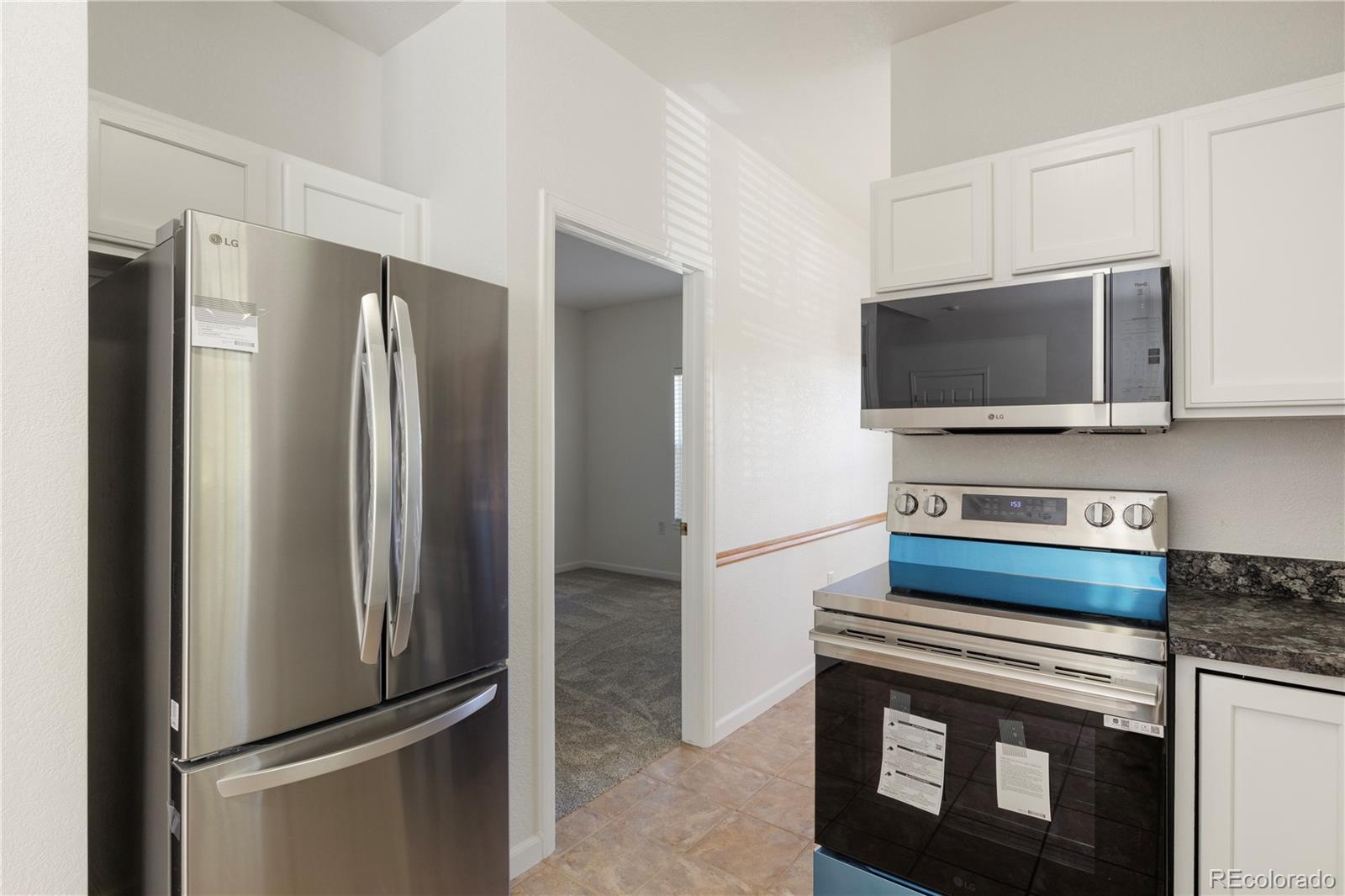 1480 Thunder Butte Road Castle Rock, CO 80109 - Photo 17 of 35 a view of kitchen with stainless steel appliances and refrigerator