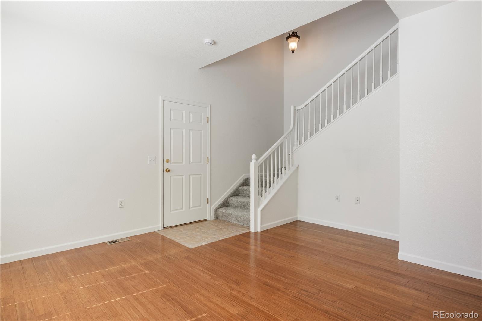 1480 Thunder Butte Road Castle Rock, CO 80109 - Photo 22 of 35 a view of entryway and hall with wooden floor