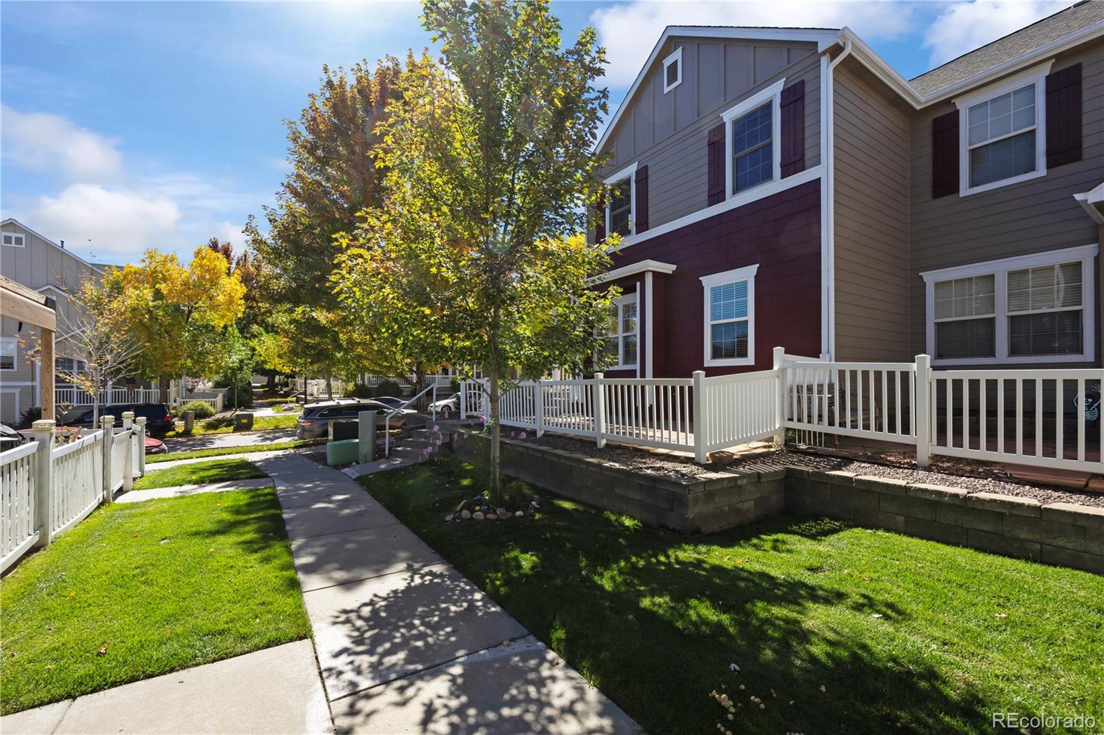 1480 Thunder Butte Road Castle Rock, CO 80109 - Photo 3 of 35 a backyard of a house with fountain table and chairs