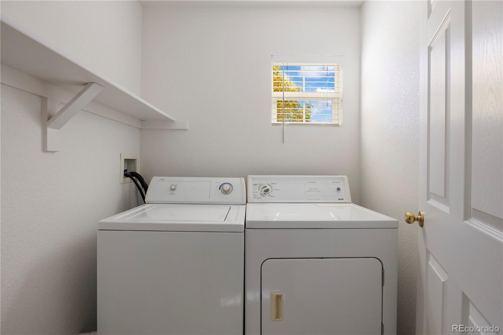 1480 Thunder Butte Road Castle Rock, CO 80109 - Photo 35 of 35 a utility room with dryer and washer