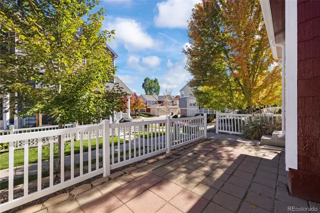 a view of a balcony with wooden fence