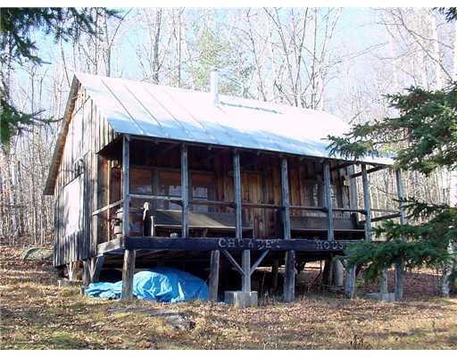 148 Wheeler Hill Road Phillips, ME 04966 - Photo 14 of 23 Exterior Front. The cabin in the...