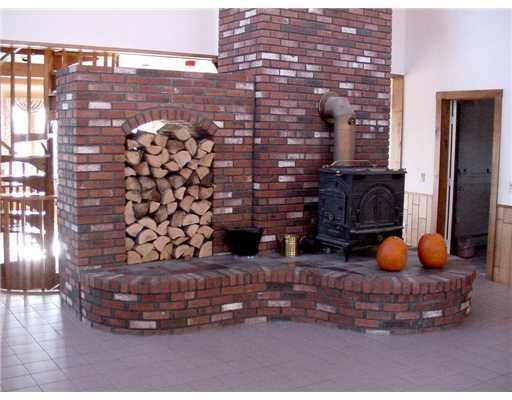 148 Wheeler Hill Road Phillips, ME 04966 - Photo 5 of 23 Living Room. Brick hearth has wood...