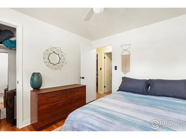 a bedroom with a bed and cabinets