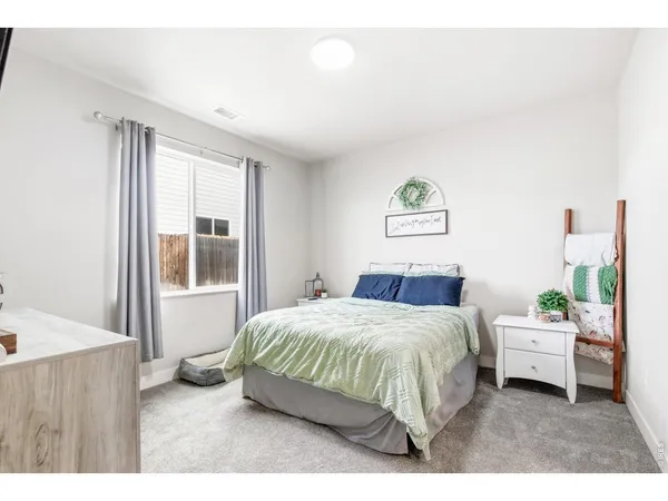 a bedroom with a bed and a table