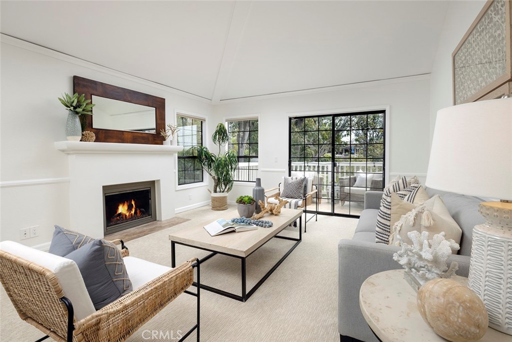 501 Morning Canyon Road Corona del Mar, CA 92625 - Photo 1 of 1 a living room with furniture a fireplace and a large window