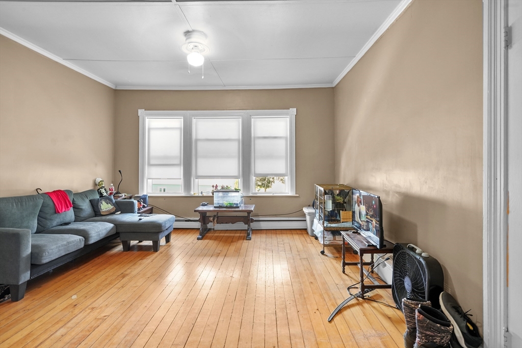 283 Fall River Avenue Seekonk, MA 02771 - Photo 13 of 32 a living room with furniture and a wooden floor