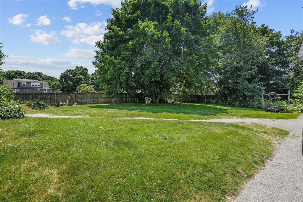 283 Fall River Avenue Seekonk, MA 02771 - Photo 30 of 32 a view of a big yard with a large trees