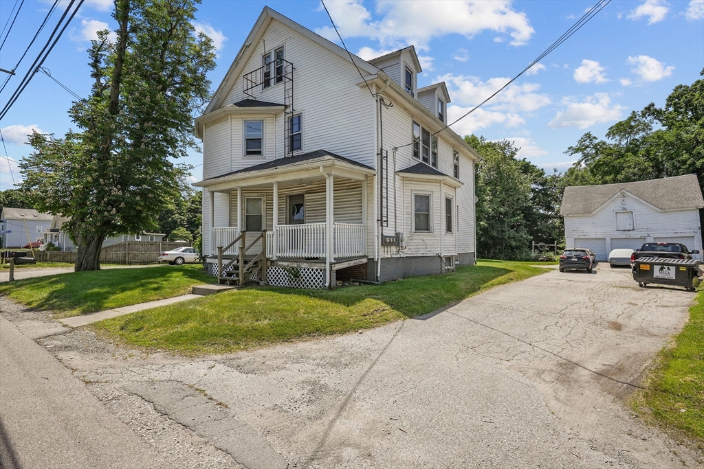 283 Fall River Avenue Seekonk, MA 02771 - Photo 31 of 32 a front view of a house with a yard and trees