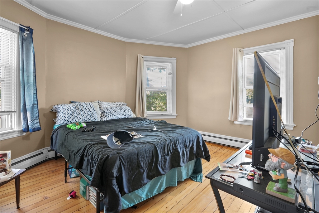 283 Fall River Avenue Seekonk, MA 02771 - Photo 8 of 32 a bedroom with a bed and a window