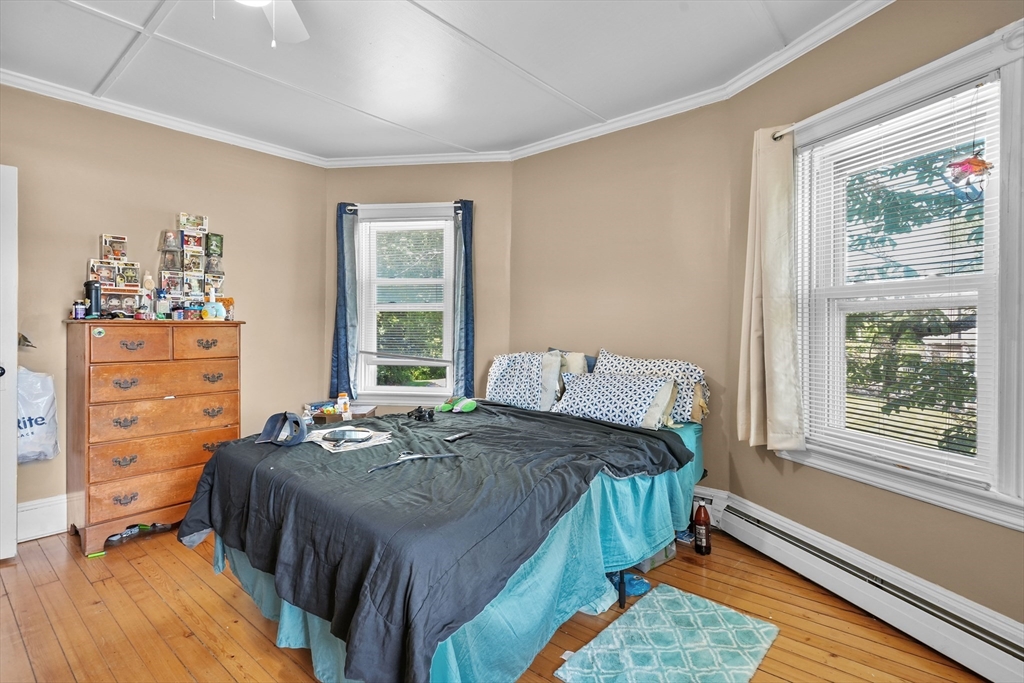 283 Fall River Avenue Seekonk, MA 02771 - Photo 10 of 32 a bedroom with a bed and a window