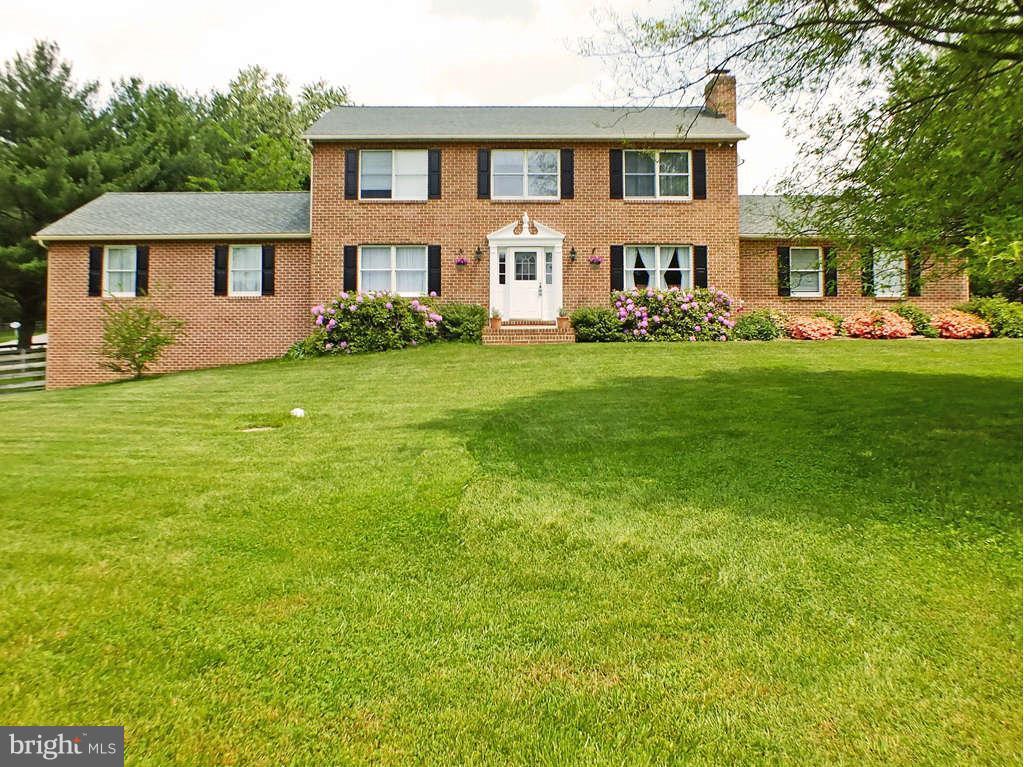 18607 Brick Store Road Hampstead, MD 21074 - Photo 1 of 30 a front view of a house with garden