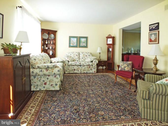 18607 Brick Store Road Hampstead, MD 21074 - Photo 3 of 30 a living room with furniture and a bed