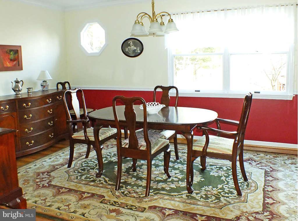18607 Brick Store Road Hampstead, MD 21074 - Photo 5 of 30 a view of a dining room with furniture and a rug