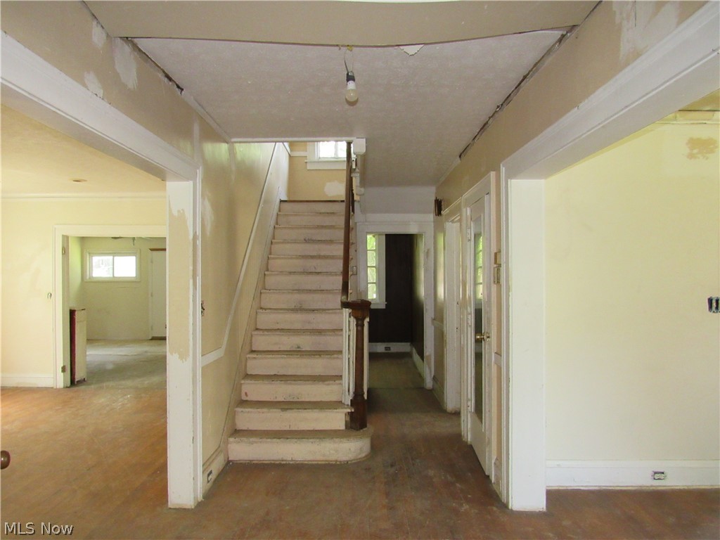 1726 Lee Road Cleveland Heights, OH 44118 - Photo 4 of 36 Interior staircase featuring wood treads and a wood handrail
