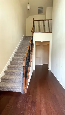 a view of entryway with wooden floor