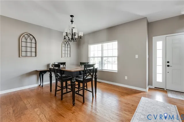 a view of a dining room with furniture and window