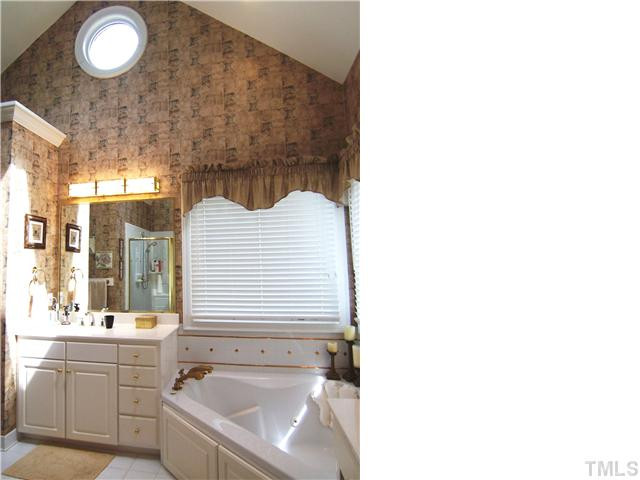908 Rockfall Court Raleigh, NC 27614 - Photo 12 of 25 The spacious vaulted Master Bath offers a tiled floor/corner shower/tub surround, sep sinks, corner whirlpool tub & private toilet rm. Master Bath/Spa
