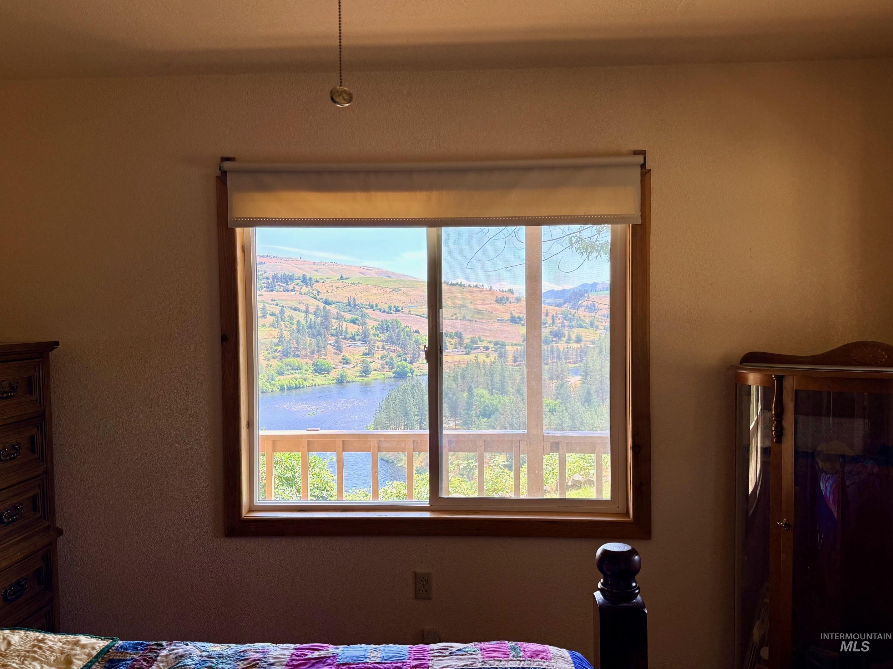 35322 River Road Lenore, ID 83541 - Photo 16 of 42 Large picture window framed in wood-finish trim