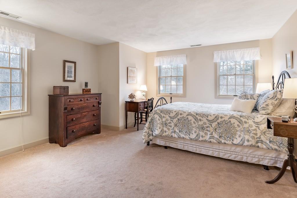 19 Townsend Farm Road Boxford, MA 01921 - Photo 27 of 36 a bedroom with a bed and a dresser