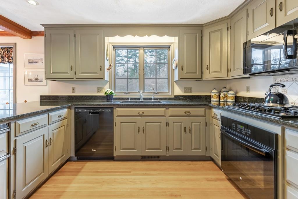 19 Townsend Farm Road Boxford, MA 01921 - Photo 4 of 36 a kitchen with stainless steel appliances granite countertop a stove a sink and a microwave