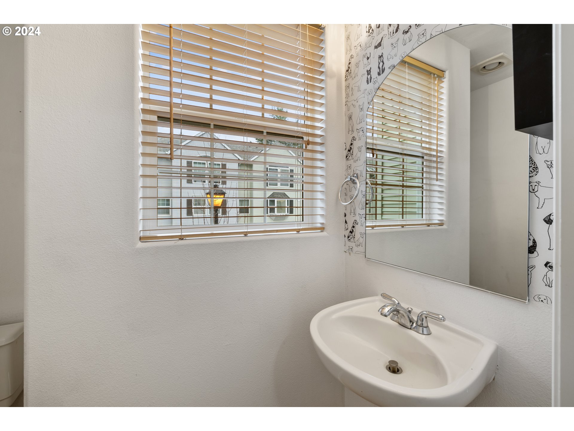 14340 Southwest Cougar Ridge Drive Beaverton, OR 97008 - Photo 14 of 37 a bathroom with a sink and a mirror