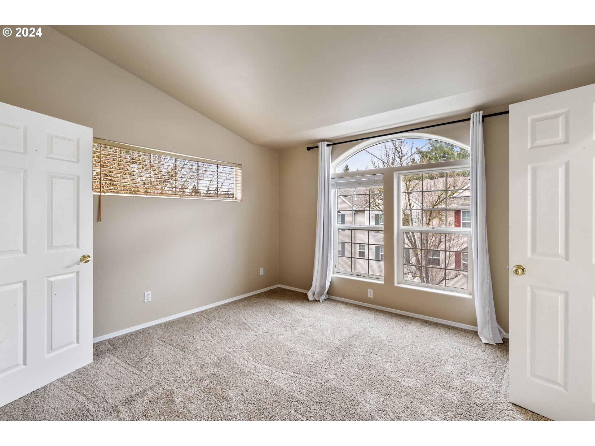 14340 Southwest Cougar Ridge Drive Beaverton, OR 97008 - Photo 18 of 37 a view of an empty room with a window