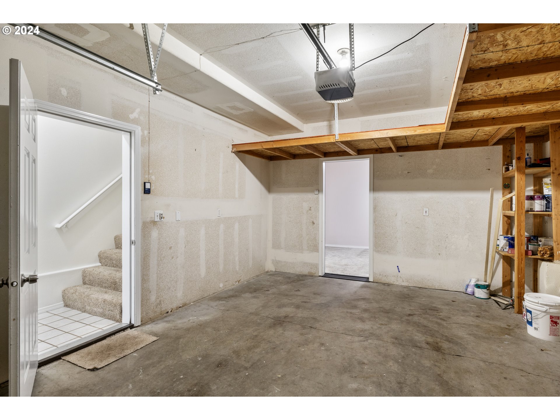 14340 Southwest Cougar Ridge Drive Beaverton, OR 97008 - Photo 28 of 37 a view of a room with wooden stairs