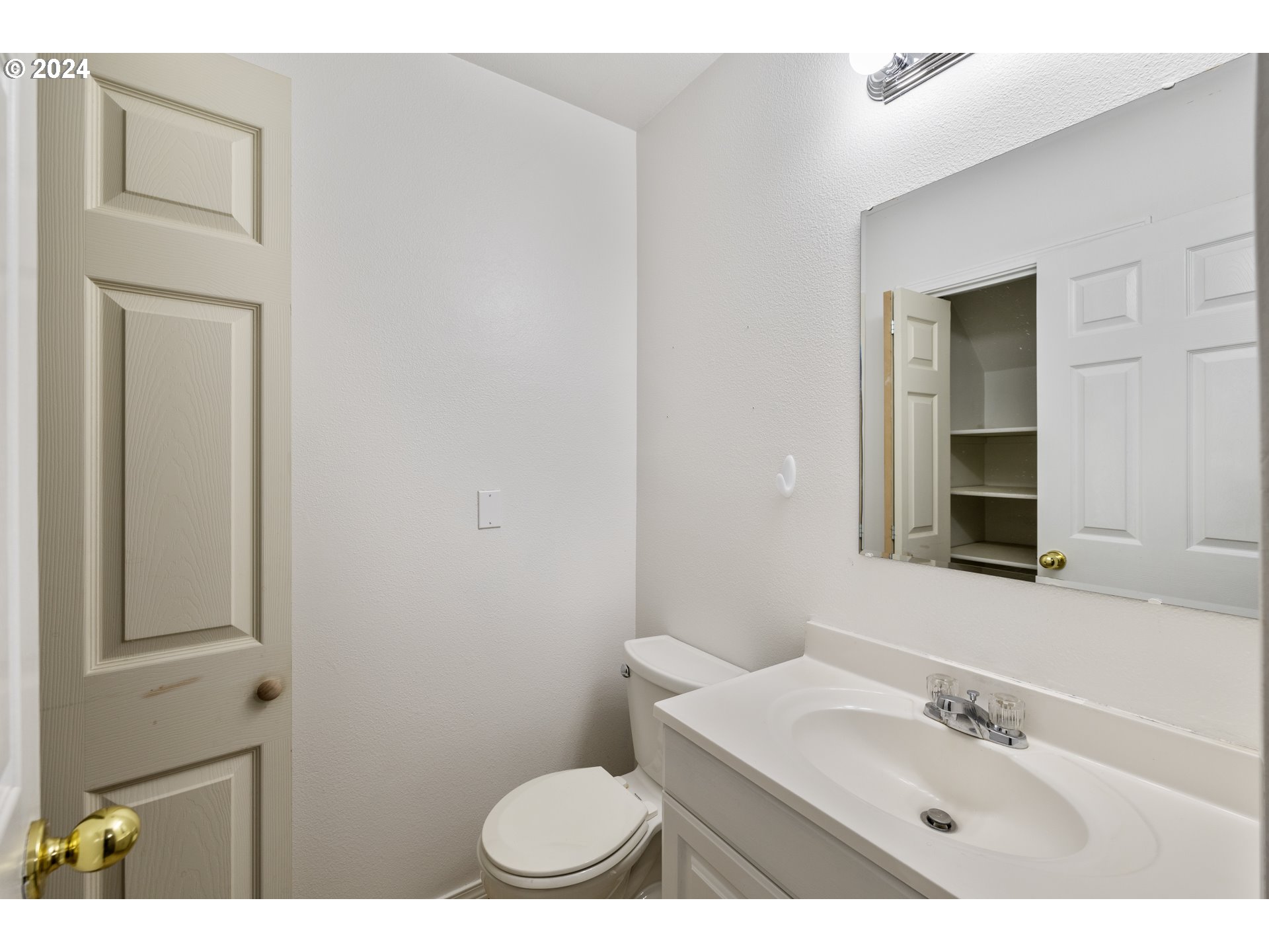14340 Southwest Cougar Ridge Drive Beaverton, OR 97008 - Photo 30 of 37 a bathroom with a sink a toilet and mirror