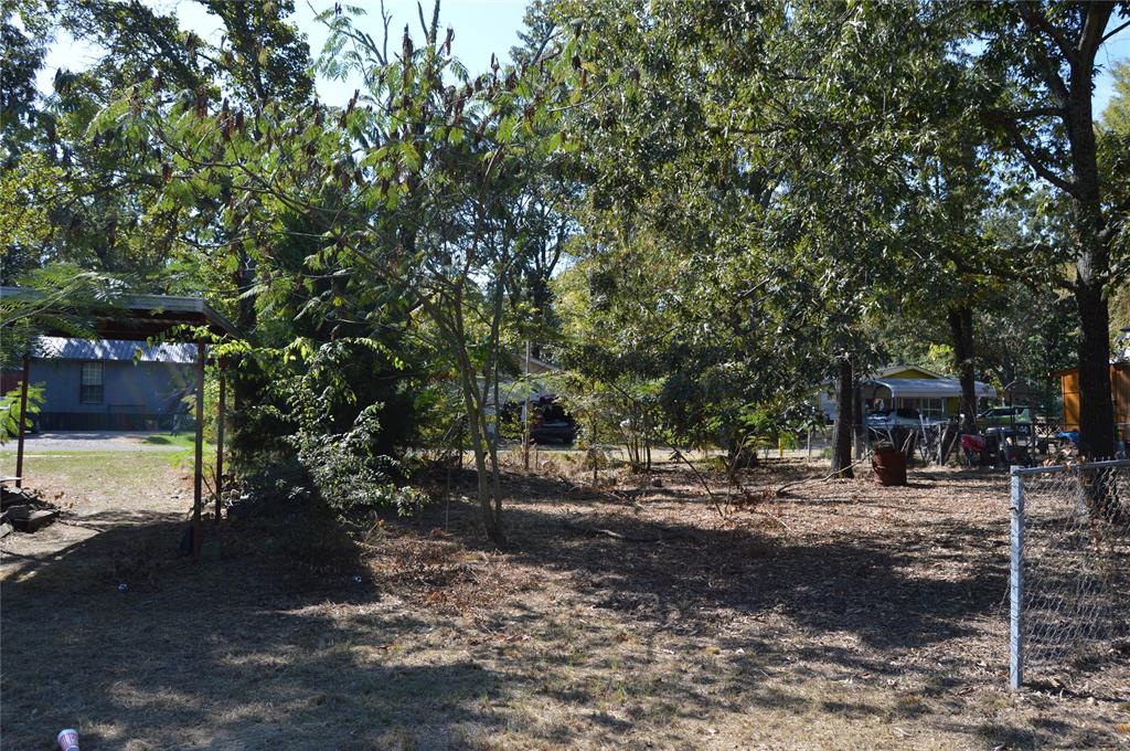 7704 Private Road 7704 Road, Unit 7704 Emory, TX 75440 - Photo 12 of 20 a backyard of a house with lots of green space