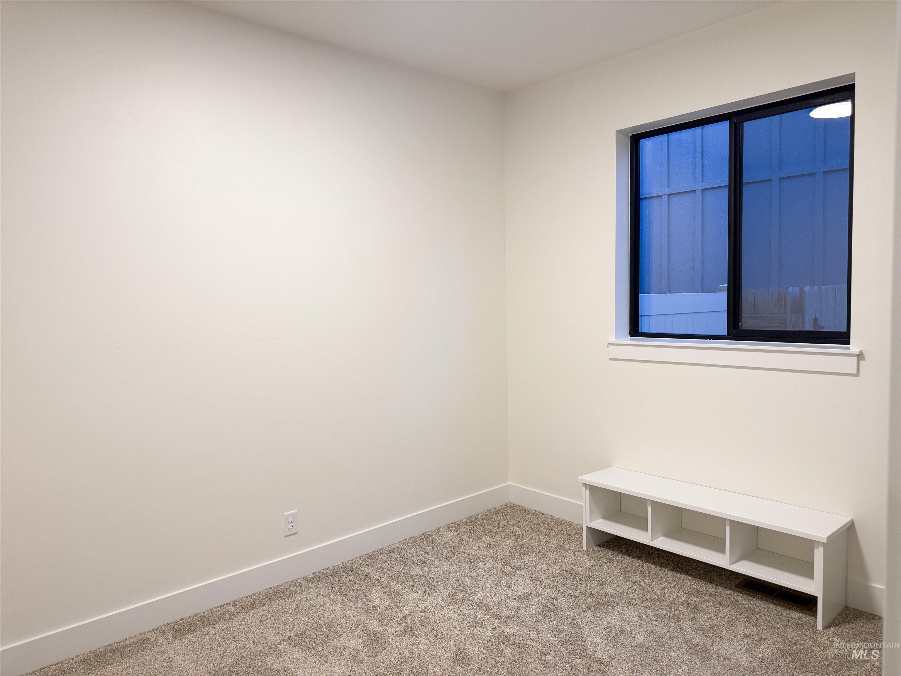 245 Whitman Street Albion, ID 83311 - Photo 8 of 15 Empty room with light carpet and baseboards